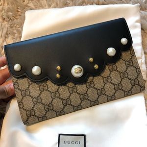 Gucci pearl studded GG canvas clutch
